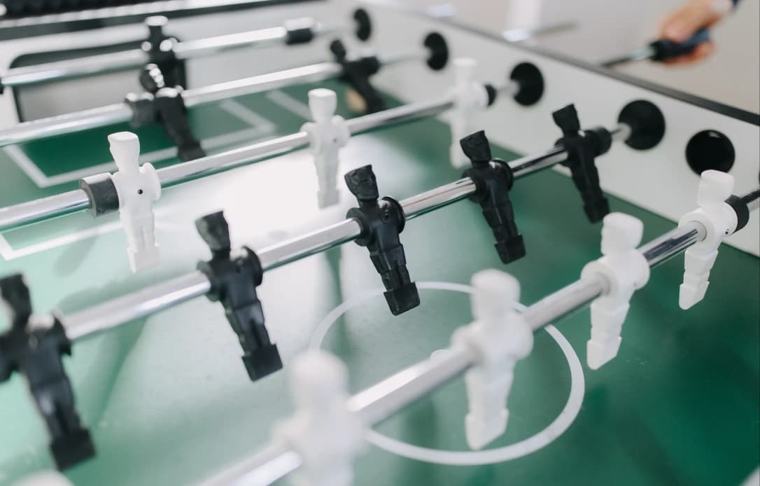 Team playing foosball